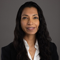 Samira Jabbar, board member for youth volunteer programs Texas, poses in a blazer.