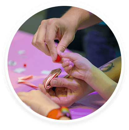 Teens shape a candy cane together, highlighting youth volunteer programs in Texas.