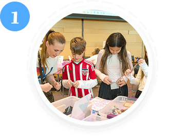 A woman and three kids do a volunteering project in a youth volunteer program Texas.