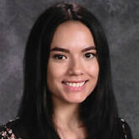 A smiling young woman representing youth volunteer programs in Texas.