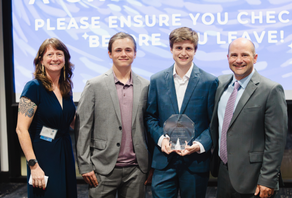 Four volunteers at Annual Fundraiser Big Night Out, celebrating youth volunteer programs Texas.