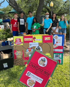 Teen Advisory Board youth volunteering in Texas at canned food drive with donation bins.